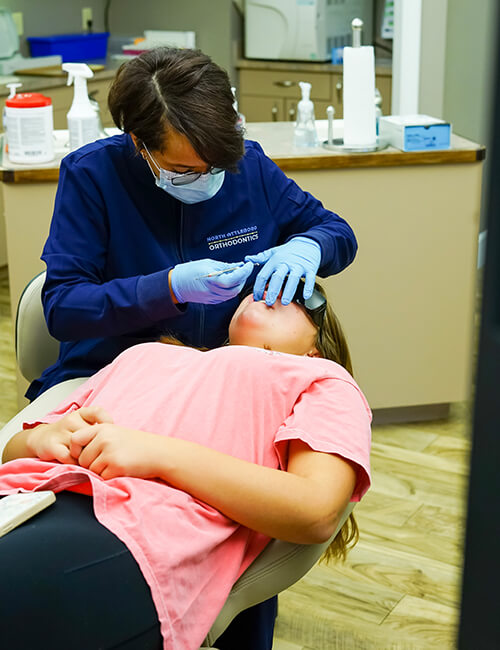 North Attleboro Orthodontics Staff Working on patient